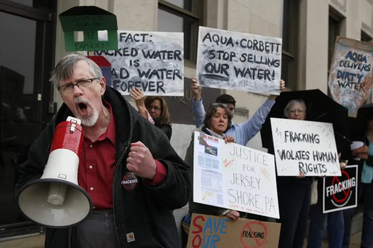 Nathan Sooy, Pennsylvania coordinator for Clean Water Action, speaking at a protest in front of Aqua America headquarters in Bryn Mawr in 2012.