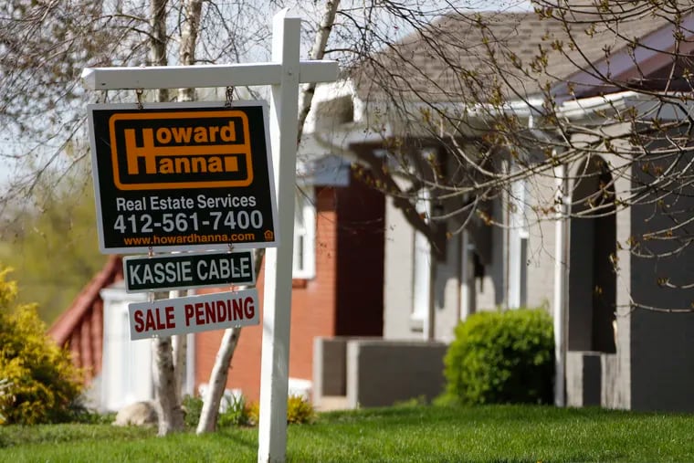 This file photo shows a sale-pending sign on a home in Mount Lebanon, Pa.