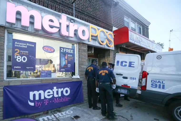 Police remove the body of the robbery suspect from the Metro PCS store on Elmwood Avenue near 70th Street. A man who attempted to rob the phone store was shot dead by an employee police said. The gunfire erupted just after 4:05 p.m., when an armed man described as in his late 30s entered the store and attempted a robbery. The employee, who has a permit to carry a concealed firearm, fired his gun several times and struck the suspect.  Monday,  August 26, 2019.