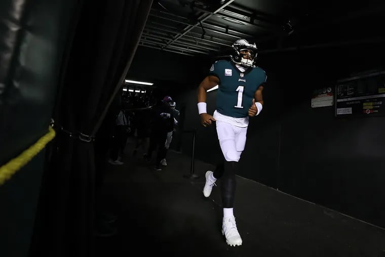 Eagles quarterback Jalen Hurts jogging out of the tunnel and onto the field at Lincoln Financial Field ahead of Sunday night's game against the Dallas Cowboys.