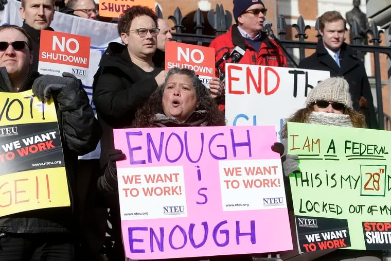 Internal Revenue Service employees during a rally by federal employees and supporters, Thursday, Jan. 17, 2019, in front of the Statehouse, in Boston, held to call for an end of the partial shutdown of the federal government.