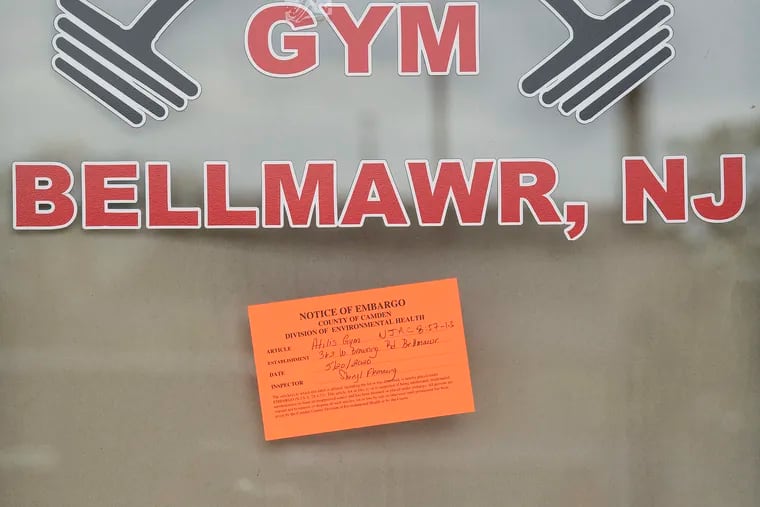 An embargo notice by the New Jersey Department of Health is shown posted on the windows of Atilis Gym in Bellmawr, N.J. Thursday, May 21, 2020.The New Jersey Department of Health has reportedly shut down Atilis Gym in Bellmawr, which had defied shutdown orders earlier this week.