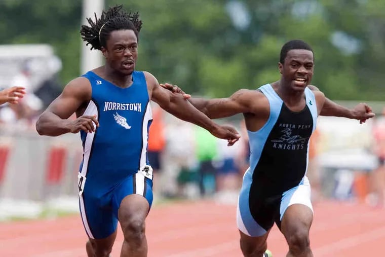 Norristown's Tyler Smith finishes ahead of North Penn's Brandon Mercer to win state title in the Class AAA 100-meter dash.