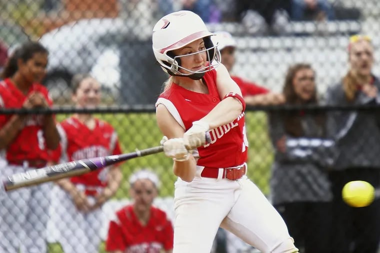 Souderton's Angie Carty swings and connects on a two-run triple against Council Rock North. Host Souderton went on to win, 3-2, Saturday in a nonleague softball game.