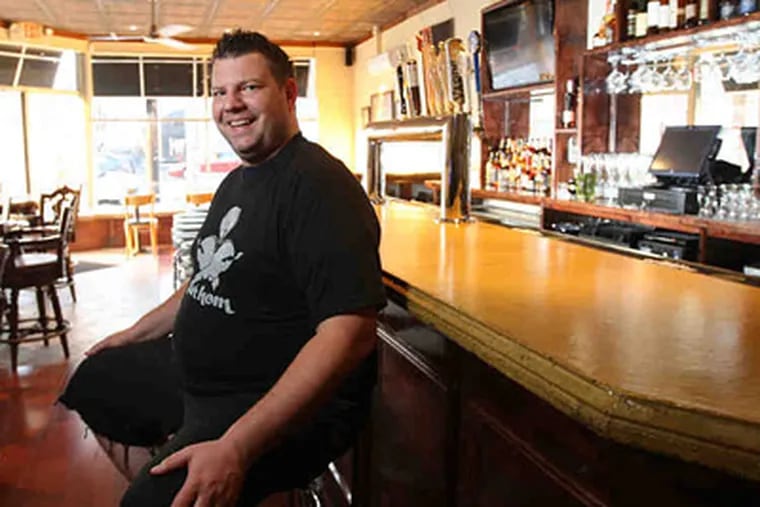 Mike Stollenwerk at the bar of Fathom Seafood House in Fishtown. (MICHAEL BRYANT / Staff Photographer)