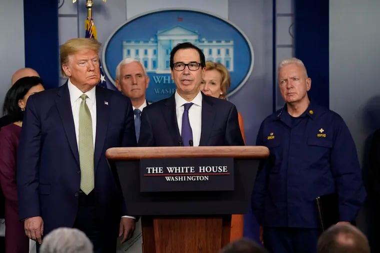 Treasury Secretary Steven Mnuchin speaks during a press briefing with the coronavirus task force, at the White House, Tuesday, March 17, 2020, in Washington, as President Donald Trump looks on.