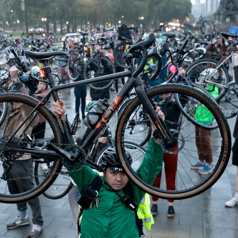 The participants raised their bikes in a memorial bike lift once they reached the Art Museum during the Ride of Silence in Philadelphia. The ride, from City Hall to the Art Museum, honors Philadelphia cyclists killed or injured by motor vehicles.