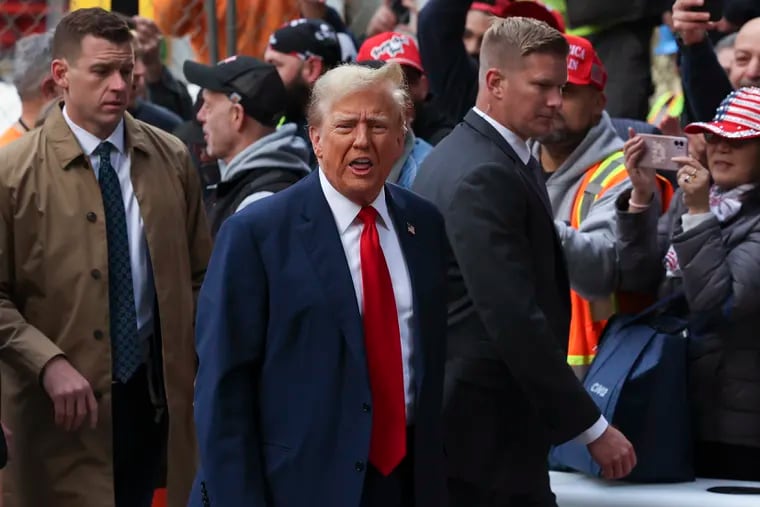 Former President Donald Trump reacts while meeting with construction workers at the construction site of the new JPMorgan Chase headquarters in midtown Manhattan on Thursday in New York.