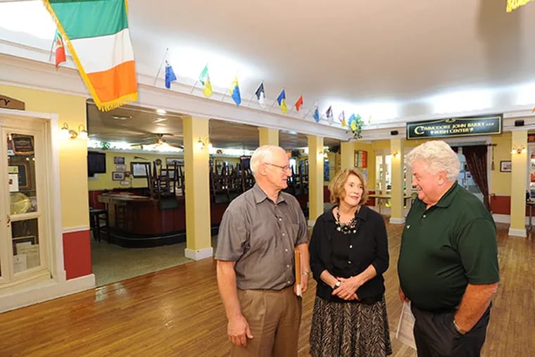 Former club president Sean McMenamin, board member Kathy McGee-Burns, and current president Vincent Gallagher gather  to discuss ways out of a financial crisis facing the club due to increased property taxes and mandated building renovations at the Commodore John Barry Irish Center in Mount Airy, Aug. 4, 2014.  ( CLEM MURRAY / Staff Photographer )