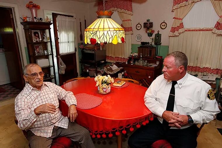 Anthony Strazzeri (left), 96, chats with Neil Calore (right), a visitor with Aid for Friends on September 15, 2014.   ( MICHAEL S. WIRTZ / Staff Photographer )
