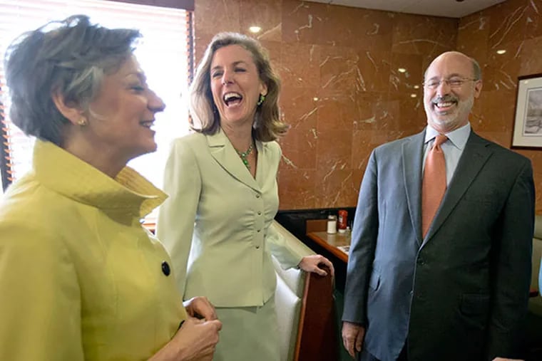 Pennsylvania Democratic gubernatorial nominee Tom Wolf, right, former state Environmental Protection Secretary Katie McGinty, center, and U.S. Rep. Allyson Schwartz, D-Pa., meet before a meal at the Oregon Diner, Friday, May 23, 2014, in Philadelphia. The group and others gathered in what  U.S. Rep. Bob Brady, D-Pa., billed as a "unity" breakfast with the three candidates, State Treasurer Rob McCord, McGinty, and Schwartz, Wolf defeated in the primary election after the campaign turned particularly nasty in the last six weeks. (AP Photo/Matt Rourke)