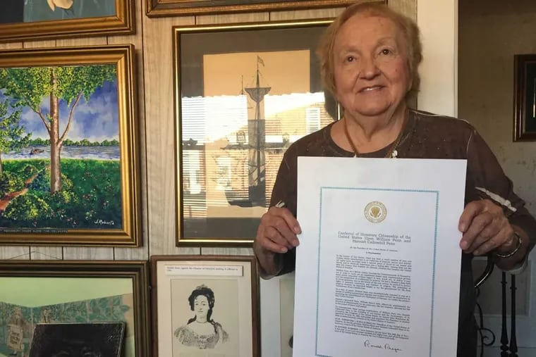 Elaine Peden, 88, of Frankford, with a copy of the proclamation that certified William and Hannah Penn as honorary citizens of the United States.