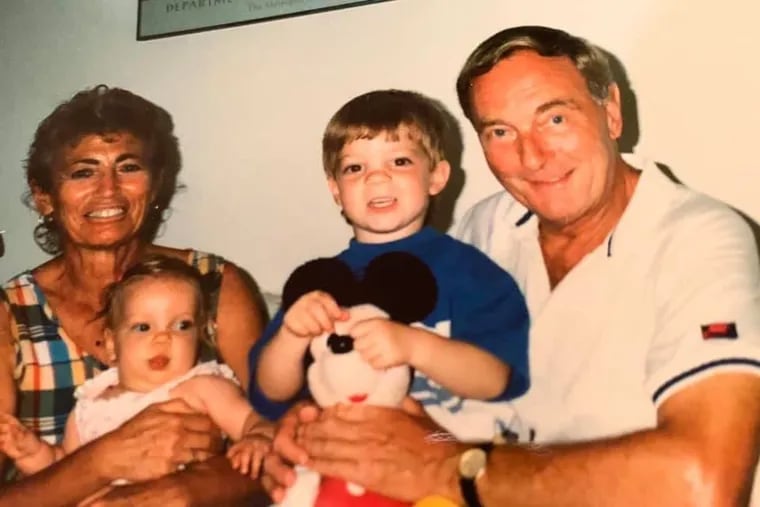 Mr. Laker (right), with his wife, Etta, and grandchildren Anna and Josh.