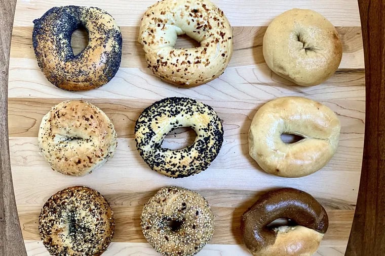 A sampling of Philly-area bagels. Top row from left: a poppy from K&A Bagels in Cherry Hill, an onion from the Bagel Place in Queen Village, a plain from the Bagel Spot in Cherry Hill. Middle row from left: an everything from South Street Philly Bagels, a black sesame from Knead Bagels near Washington Square, a plain from Original Bagel Co. in Broomall. Bottom row from left: an everything from Bart's Bagels in West Philadelphia, an everything from Dodo Bagels in West Philadelphia, a half-and-half from New York Bagel Bakery in Overbrook Park.