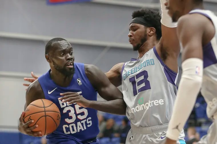 Delaware Blue Coats' Marial Shayok drives on Greensboro Swarm's Joe Chealey during the seconnd quarter of NBA G-League game in Wilmington, Del. on Nov. 11.