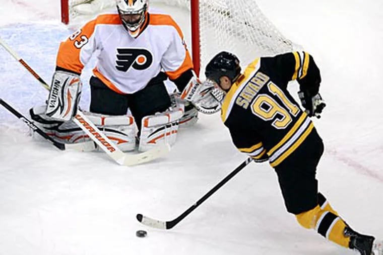 Flyers goalie Brian Boucher allowed six of the Bruins seven goals. (Charles Krupa/AP Photo)