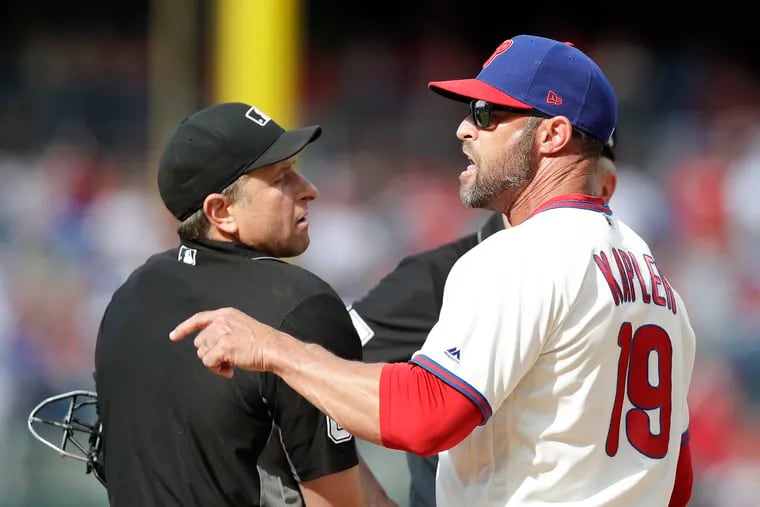 Phillies Manager Gabe Kapler points after getting ejected by home plate umpire Chris Guccione in the fourth-inning against the Miami Marlins on Saturday, June 22, 2019 in Philadelphia.