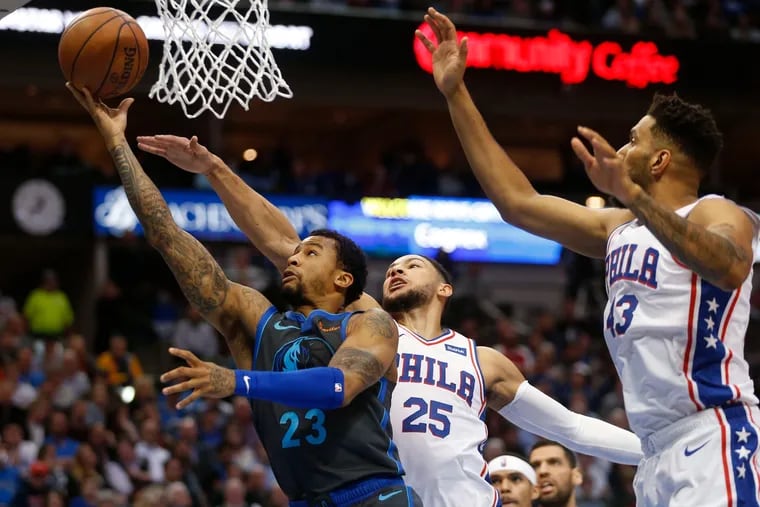 Trey Burke (23), here with the Dallas Mavericks, will serve as a reserve point guard to Ben Simmons (25) with the 76ers this season.