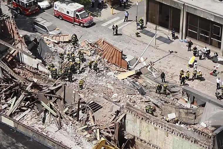 The cover of Mayor Nutter's Special Independent Advisory Commission report features an Inquirer photo from last year's fatal building collapse at a demolition site.