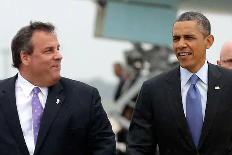 President Barack Obama walks on the tarmac with Gov. Chris Christie upon his arrival on Air Force One at McGuire Air Force Base, N.J., Tuesday, May 28, 2013. Obama traveled to New Jersey joining Christie to inspect and tour the Jersey Shore's recovery efforts from Hurricane Sandy. (AP Photo/Pablo Martinez Monsivais)