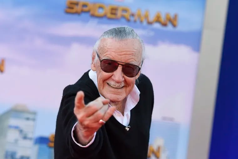 FILE - In this June 28, 2017 file photo, Stan Lee arrives at the Los Angeles premiere of "Spider-Man: Homecoming" at the TCL Chinese Theatre. A former business manager of Lee has been charged with five counts of elder abuse of the late Marvel Comics mogul. Los Angeles County prosecutors filed five counts Friday, May 10, 2019, against 43-year-old Keya Morgan, including felony allegations of theft, embezzlement, forgery or fraud against an elder adult and false imprisonment of an elder adult. A warrant has been issued for Morgan’s arrest.  (Photo by Jordan Strauss/Invision/AP, File)