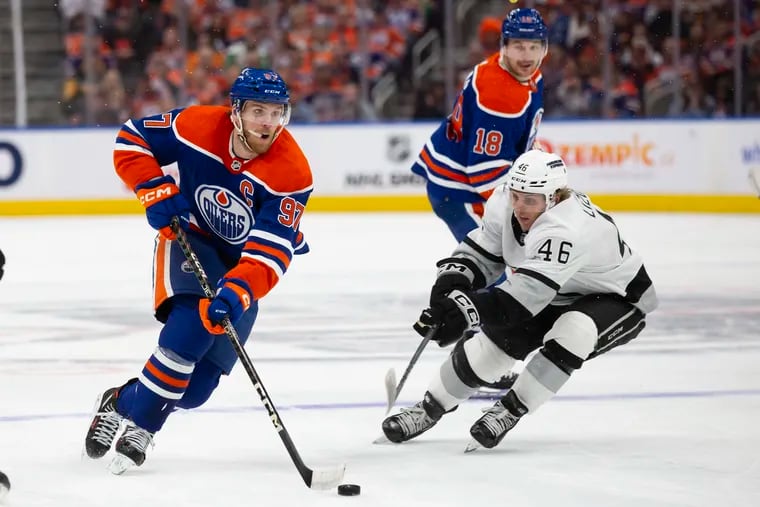 Connor McDavid #97 of the Edmonton Oilers skates the puck past Blake Lizotte #46 of the Los Angeles Kings during the second period in Game Five of the First Round of the 2024 Stanley Cup Playoffs at Rogers Place on May 1, 2024, in Edmonton, Canada.(Photo by Codie McLachlan/Getty Images)