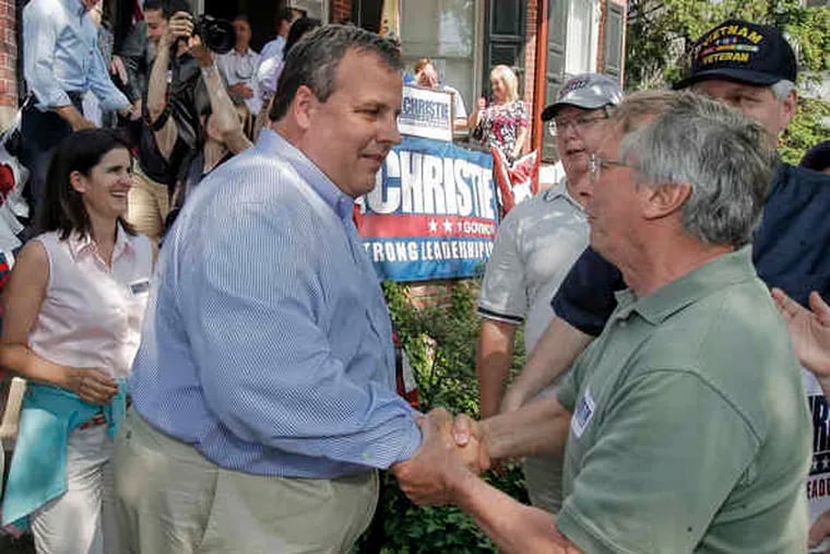 GOP gubernatorial candidate Christopher J. Christie (right) greets supporter Bob Martin after speaking at a rally in Mount Holly.