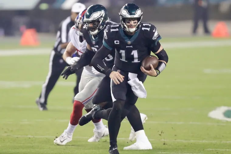 Eagles quarterback Carson Wentz runs with the football against the the New York Giants on Thursday, October 22, 2020.