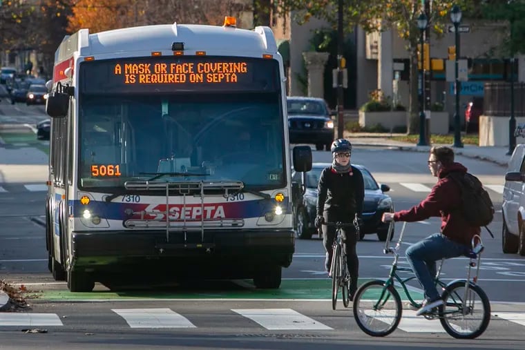 A SEPTA bus reminds riders to wear a mask to mitigate the spread of COVID-19. SEPTA's board on Thursday approved a $3 million contract to revamp its bus network.