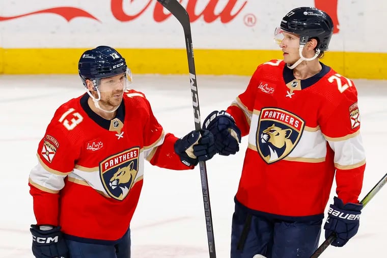 Sam Reinhart #13 is congratulated by Eetu Luostarinen #27 of the Florida Panthers after he scored a third period goal against the Toronto Maple Leafs at the Amerant Bank Arena on April 16, 2024 in Sunrise, Florida.