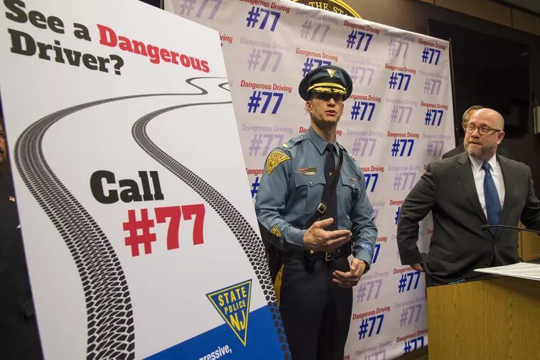 New Jersey Attorney General Chris Porrino (right) and NJ State Police Major Glen Szenzenstein answer reporters’ questions April 6, 2017, about the a new initiative with the Call #77 phone number — having citizens call into the State Police call center with tips about other drivers driving dangerously, like using their cellphones inappropriately. The call center will also be able to take in photos and video clips of the offenders.