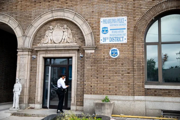 A Philadelphia Police Officer arrives at the 39th District Headquarters on May 11.