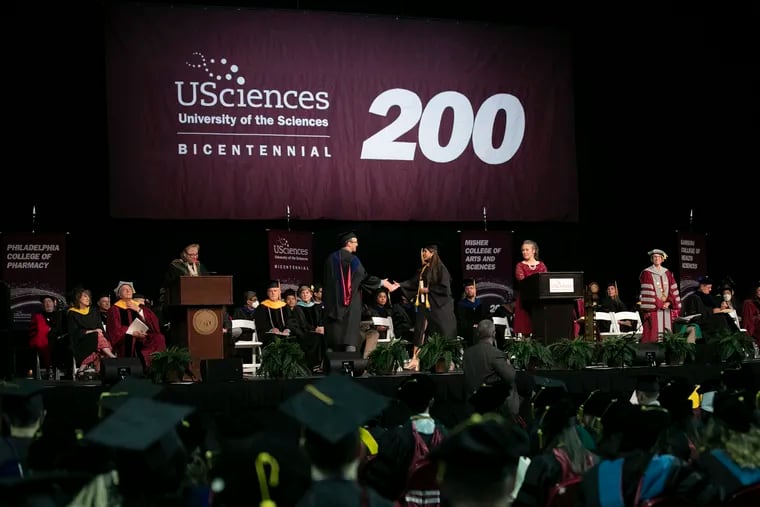 Graduates received their diplomas on stage during the University of the Sciences’ final commencement ceremony at the Liacouras Center in Philadelphia on Wednesday, May 25, 2022. The University of the Sciences will merge with and into Saint Joseph's on June 1.