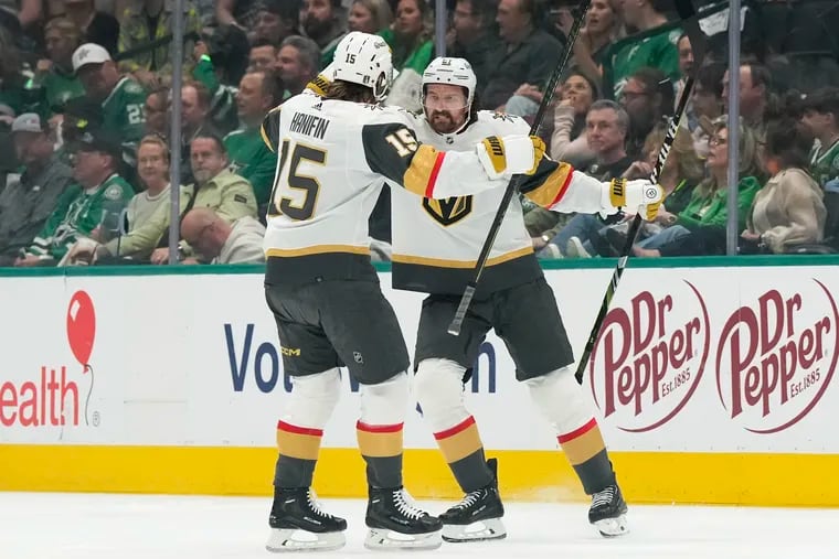 Mark Stone #61 of the Vegas Golden Knights celebrates with Noah Hanifin #15 after scoring a power-play goal against the Dallas Stars during the first period of Game Five of the First Round of the 2024 Stanley Cup Playoffs at the American Airlines Center on May 01, 2024 in Dallas, Texas. (Photo by Sam Hodde/Getty Images)