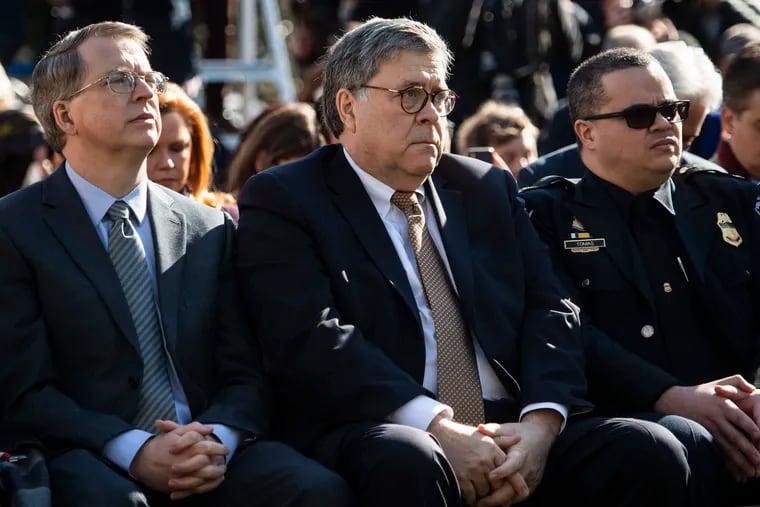 Attorney General William Barr listens to President Donald Trump speak in the Rose Garden at the White House on Friday, Feb. 15, 2019.