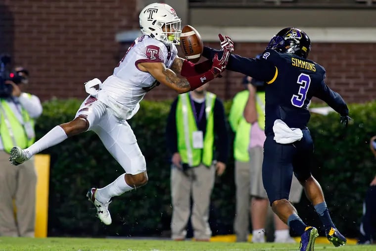 East Carolina's Travon Simmons breaks up a pass intended for Temple's Frank Nutile during the first half of a game in Greenville, N.C., Thursday, Oct. 22, 2015.