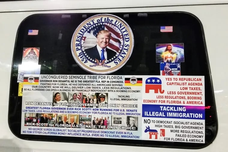 Paul Bilodeau parked at a Publix in Oakland Park last Thursday and couldn't help but notice the van that parked next to him, an old white van covered in Trump stickers.