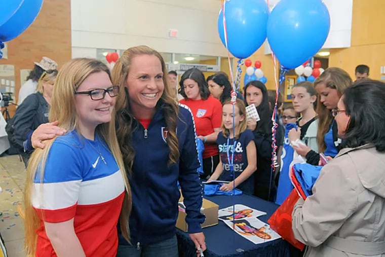 Soccer fan Brianna Platt, 16, from Toms River, New Jersey, meets Christine Rampone, from Point Pleasant, New Jersey, the oldest woman on the U.S. Soccer Team that is favored in next month's world cup, while signing autographs for fans at Ocean Medical Center 425 Jack Martin Blvd. Brick, New Jersey, Thursday, May 21, 2015, during a meet and greet with local soccer fans. (Dave Griffin/For the Inquirer)