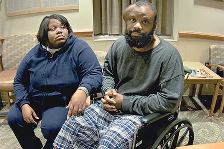 In a hospital room, Michelle and James Black discuss their brutal traffic stop in Lindenwold. (Emily Kight / Staff Photographer)