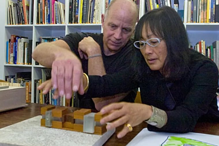 Architects Tod Williams (left) and Billie Tsien show off a model for the new Barnes Foundation on the Parkway in Philadelphia. (Clem Murray / Staff Photographer)