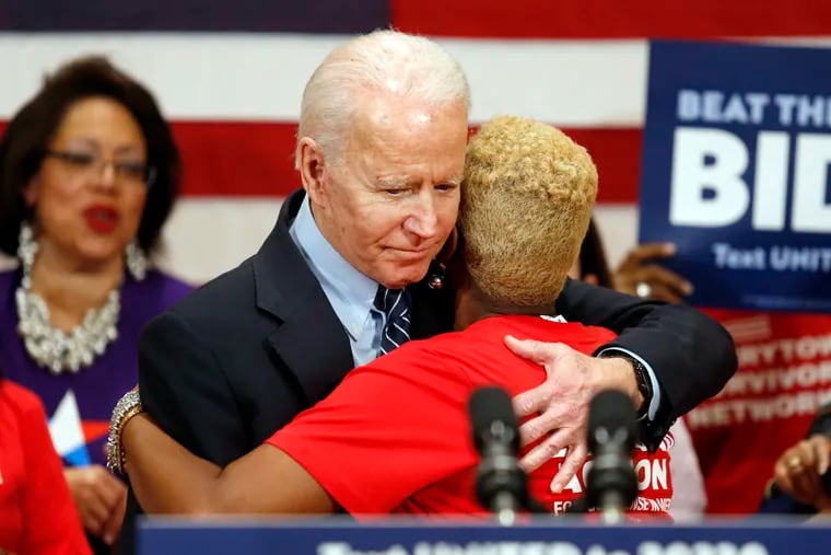 Democratic presidential candidate former Vice President Joe Biden hugs Crystal Turner of Columbus, Ohio, with Moms Demand Action during a campaign rally in Columbus, Ohio on Tuesday.