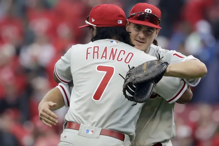 Phillies' first baseman Tommy Joseph and Phillies' third baseman Maikel Franco celebrate their 4-3 opening day win over the Cincinnati Reds on Monday, April 3, 2017 in Cincinnati.