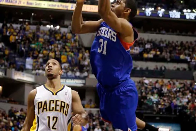 Philadelphia 76ers guard Hollis Thompson (31) shoots in front of Indiana Pacers forward Evan Turner (12) during the first half. (AP Photo/AJ Mast)