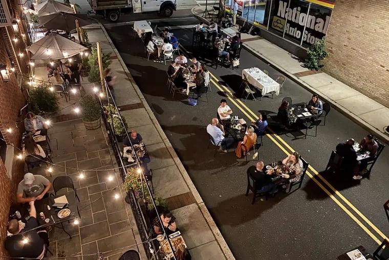 Diners fill seating on the patio and in Wood Street outside of Stove & Tap restaurant in Lansdale on Sept. 12, 2020.