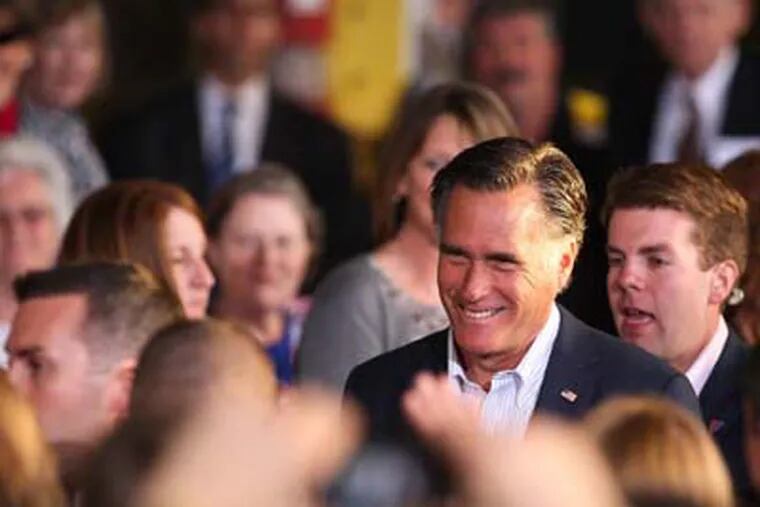 Republican presidential candidate, former Massachusetts Gov. Mitt Romney smiles during a campaign stop at RC Fabricators on Tuesday, April 10, 2012, in Wilmington, Del. (AP Photo/The Wilmington News-Journal, Suchat Pederson)