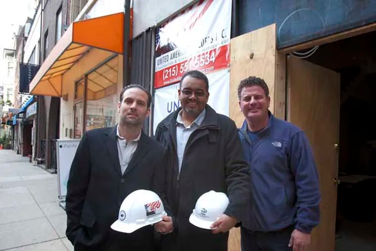Michael Brown, center, CEO of Environmental Construction Services with his Sheet Metal Superintendent Matt Rispo, left, and Rich Podulka, Director of Business Development for United American Builders Inc. outside  one of their projects , Good Stuff  Eatery on South 18th Street in Center City.  ( ED HILLE / Staff Photographer )