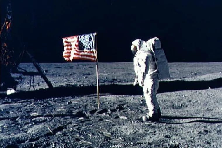 Buzz Aldrin poses for a photograph besides the U.S. flag during the Apollo 11 extravehicular activity on the surface of the moon.