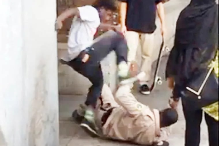 A video, posted online by a witness Friday and turned over to police on Saturday, shows a young man hitting and kicking a park ranger as others stood by laughing. YouTube