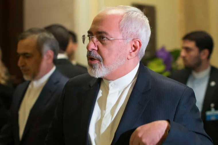 Iranian Foreign Minister Mohammad Javad Zarif heads into a negotiating session in Switzerland. One of Zarif's strolls with Secretary of State John Kerry was too much for some in Iran to bear.