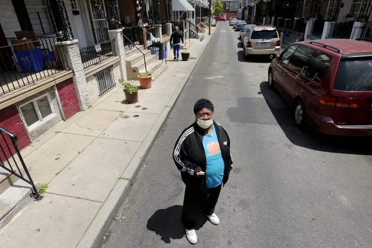 Deborah Forrest poses for a portrait outside her home in the Kensington section of Philadelphia, Pa. on May 21, 2020. Forrest, Miss Debbie, to the kids, runs Wensley Street Playstreet program, a city effort that provides food and activities for kids in the summer.